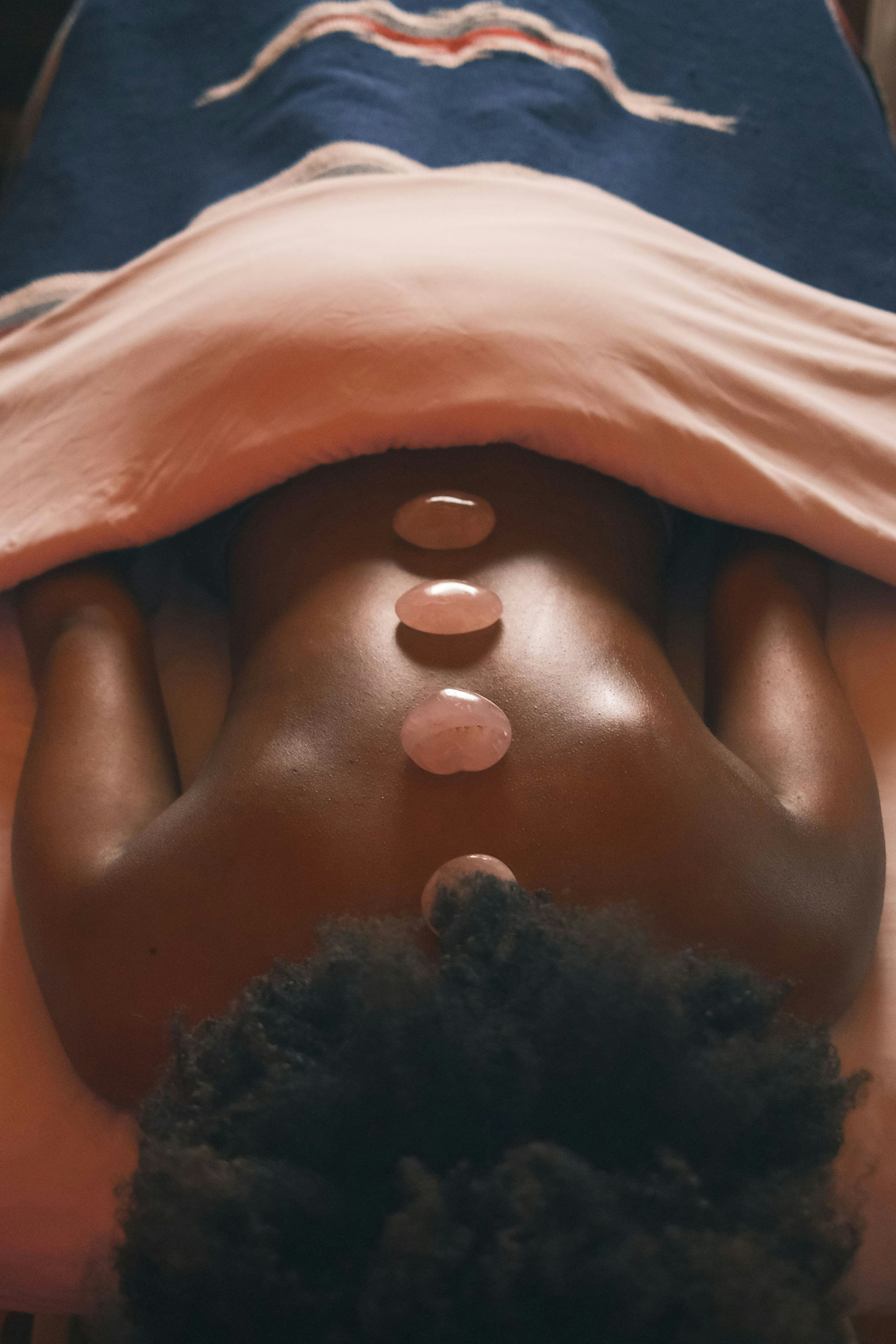 Black woman getting a massage by Taylor Heery via Unsplash