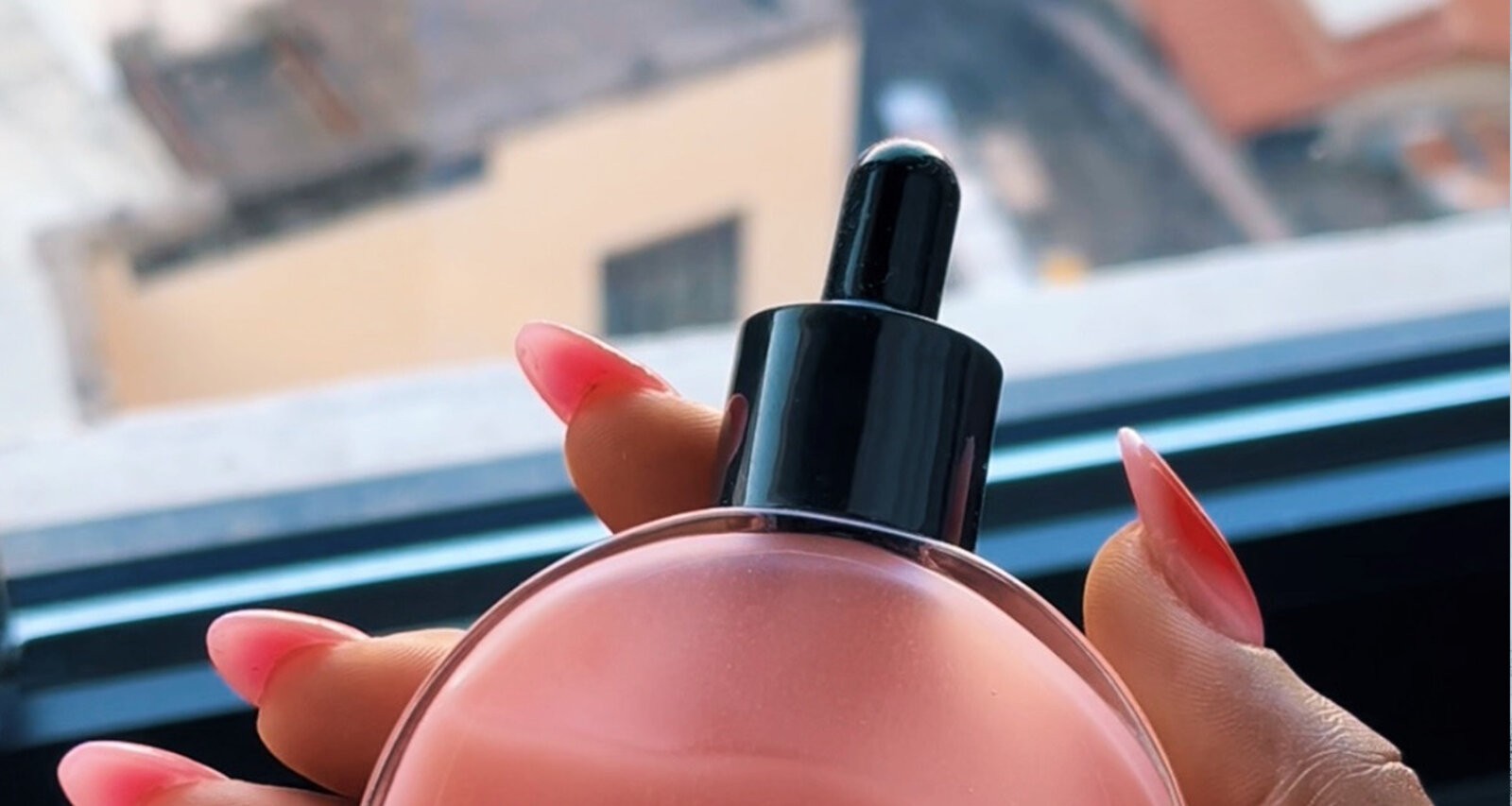 THB Scalp Drops by Dear Ketandu being held against a window