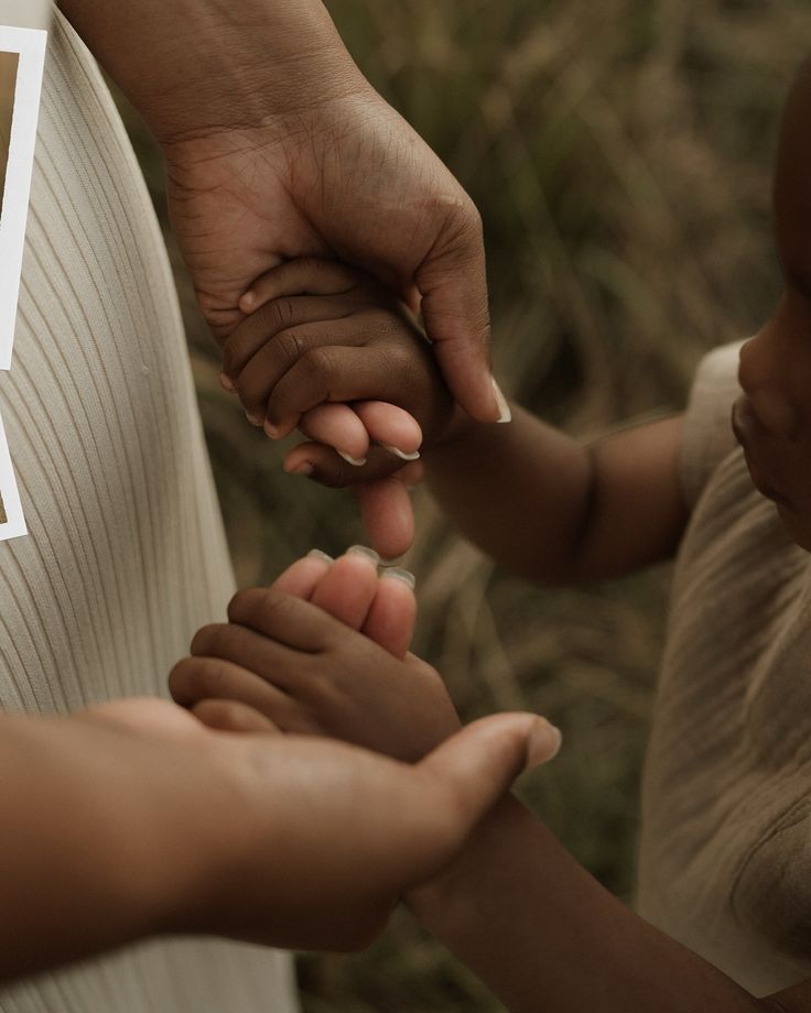 A mother holding her child's hands @by.mother.and.child via Instagram