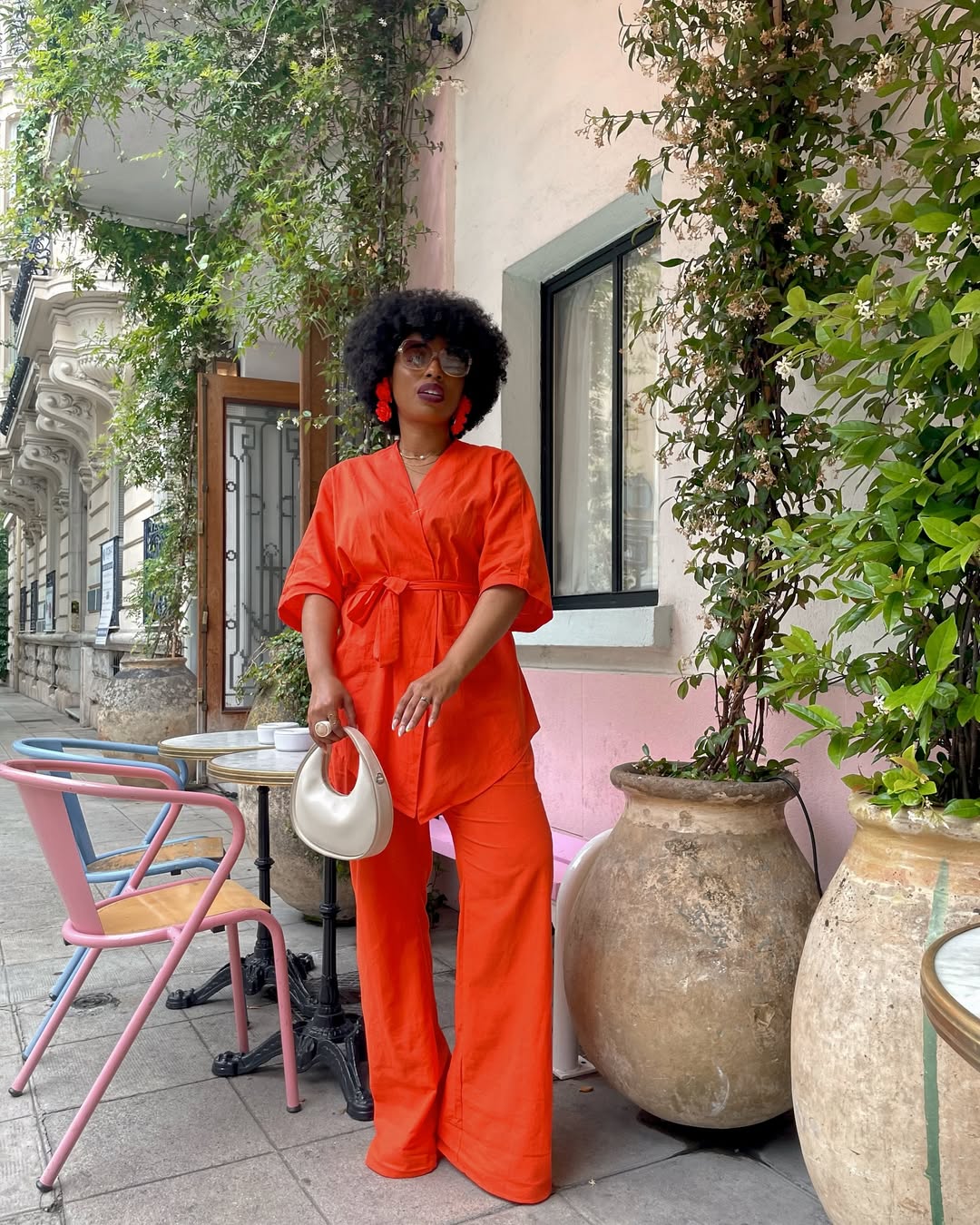 L. Shaneen wearing a Commense orange wrap co-ord via @_oohlalaland on Instagram