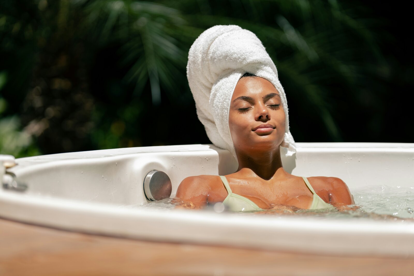 A black woman taking a steam bath by Fellipe Ditadi via Unsplash+