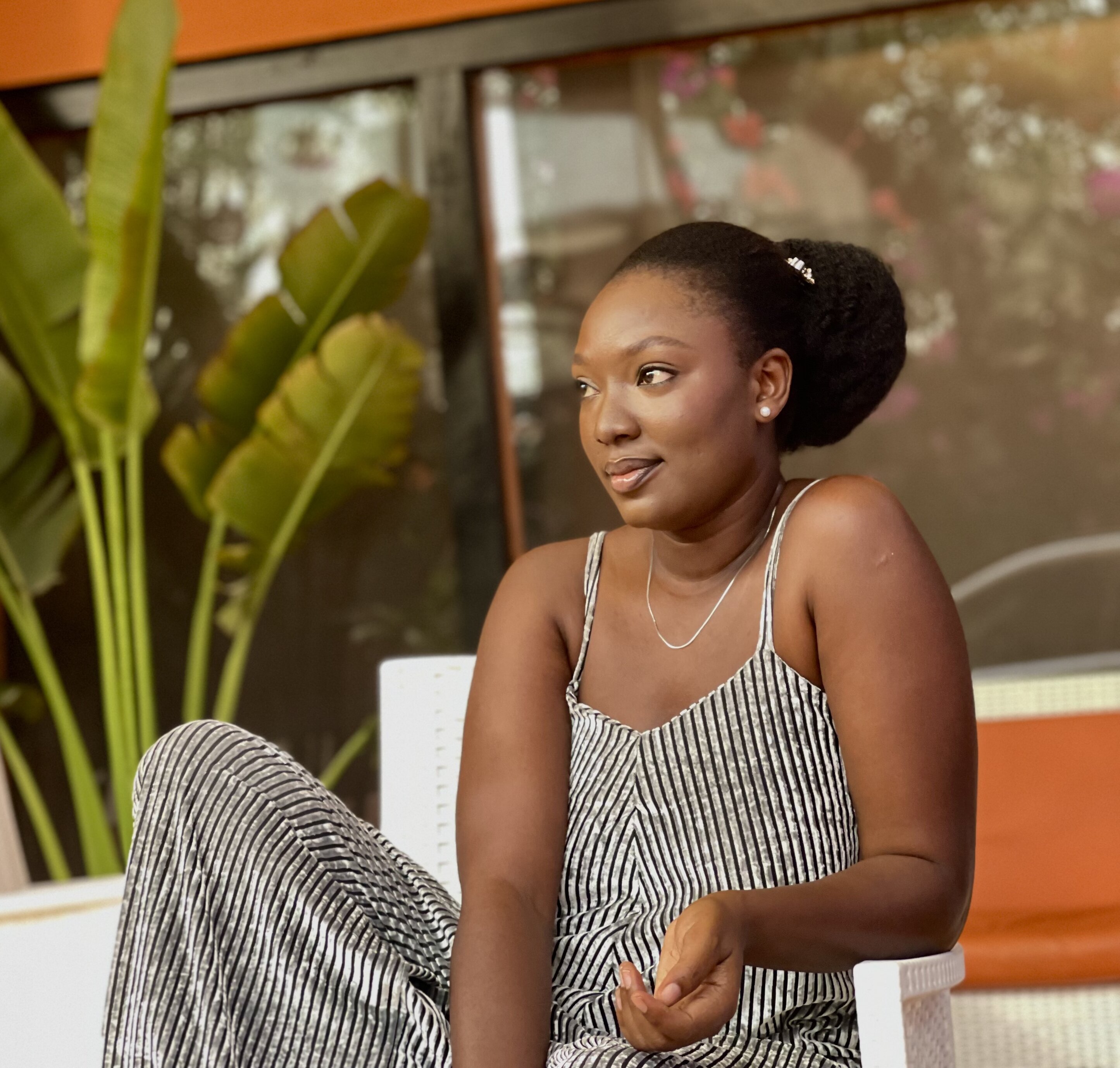 4C hair wash-day routine - Wumi Tuase-Fosudo in her natural hair styled in a bun with kinky extensions