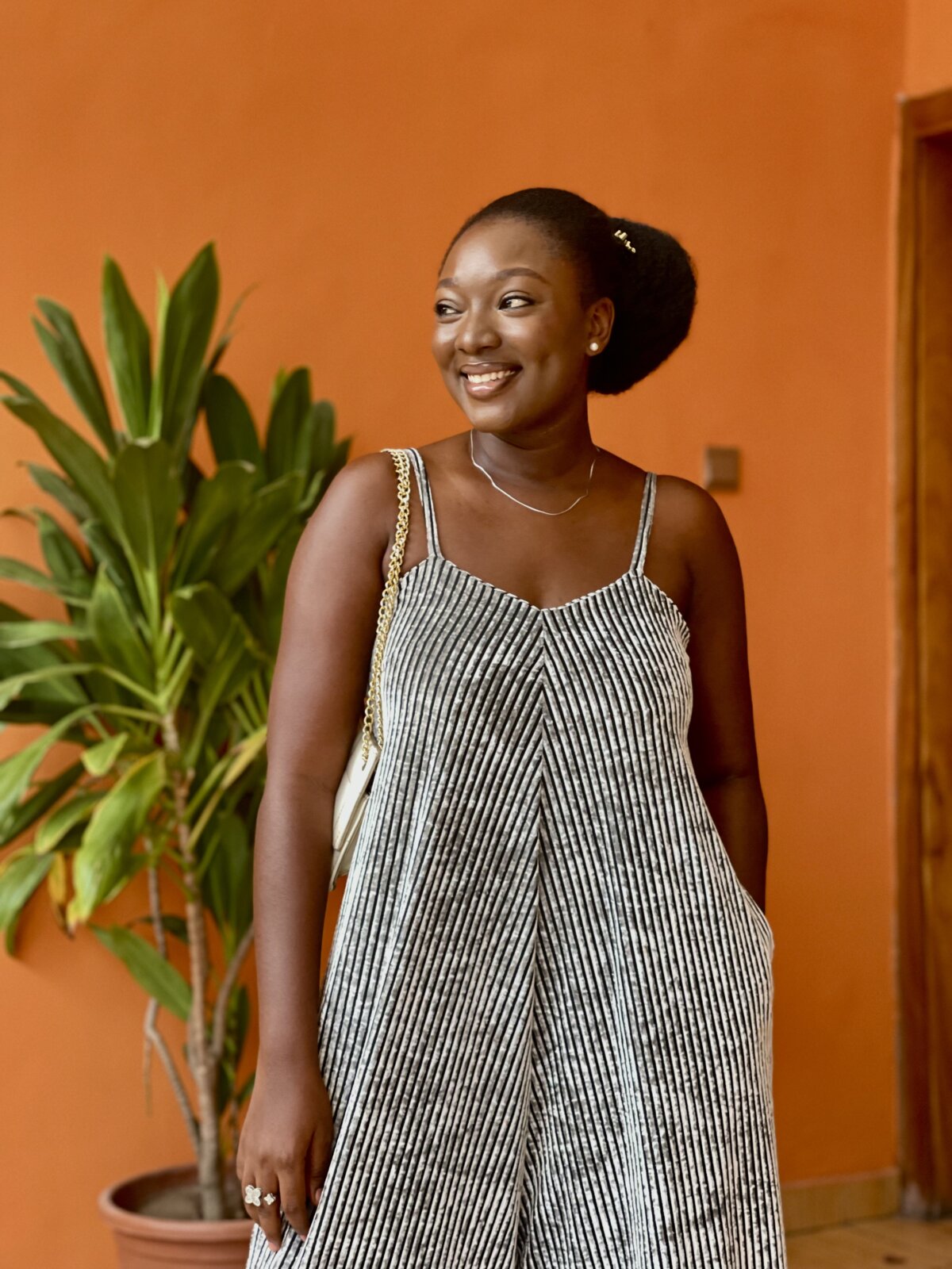 4C hair wash-day routine - Wumi Tuase-Fosudo in her natural hair styled in a bun with kinky extensions