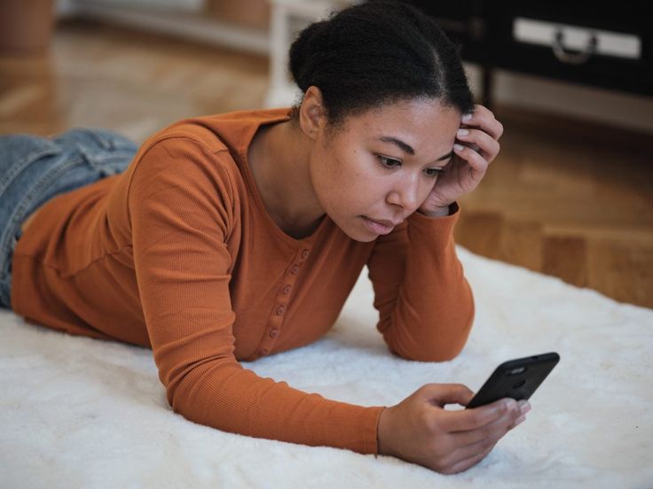 Woman on her phone via Pinterest (original creator unknown) If this is your work, please contact us for proper credit.