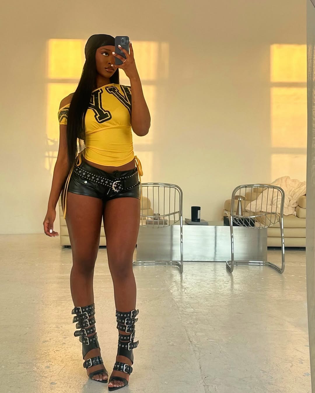 Black woman in micro shorts via @nyallay_t on Instagram