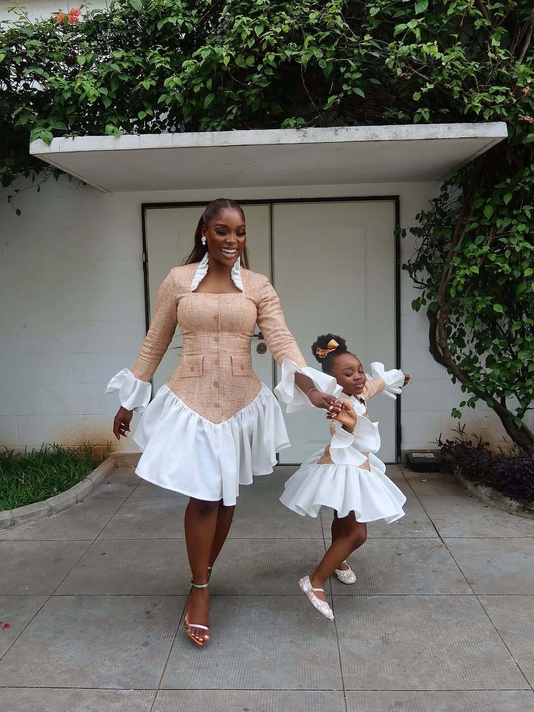 Tomike Adeoye and her daughter in matching outfits via @tomike_a on Instagram