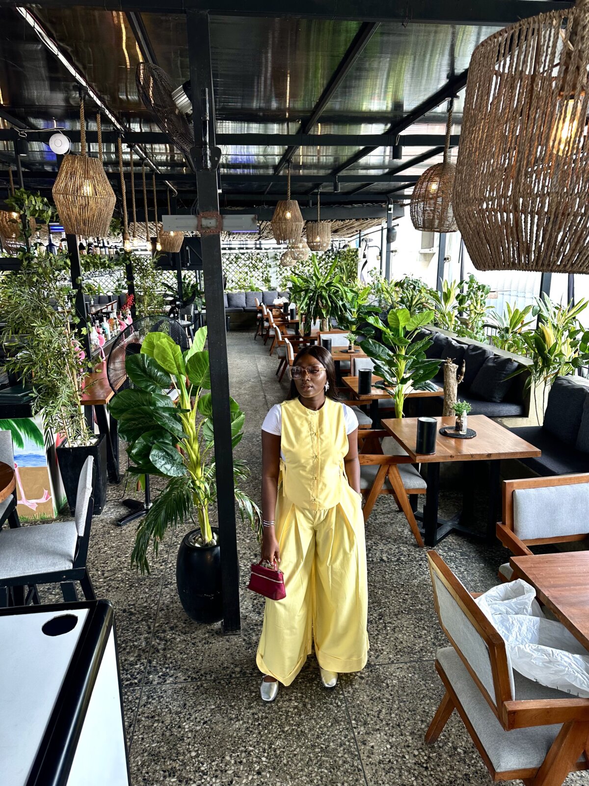 Wumi Tuase-Fosudo in butter yellow bib blouse and double pleats pants from TwentySix