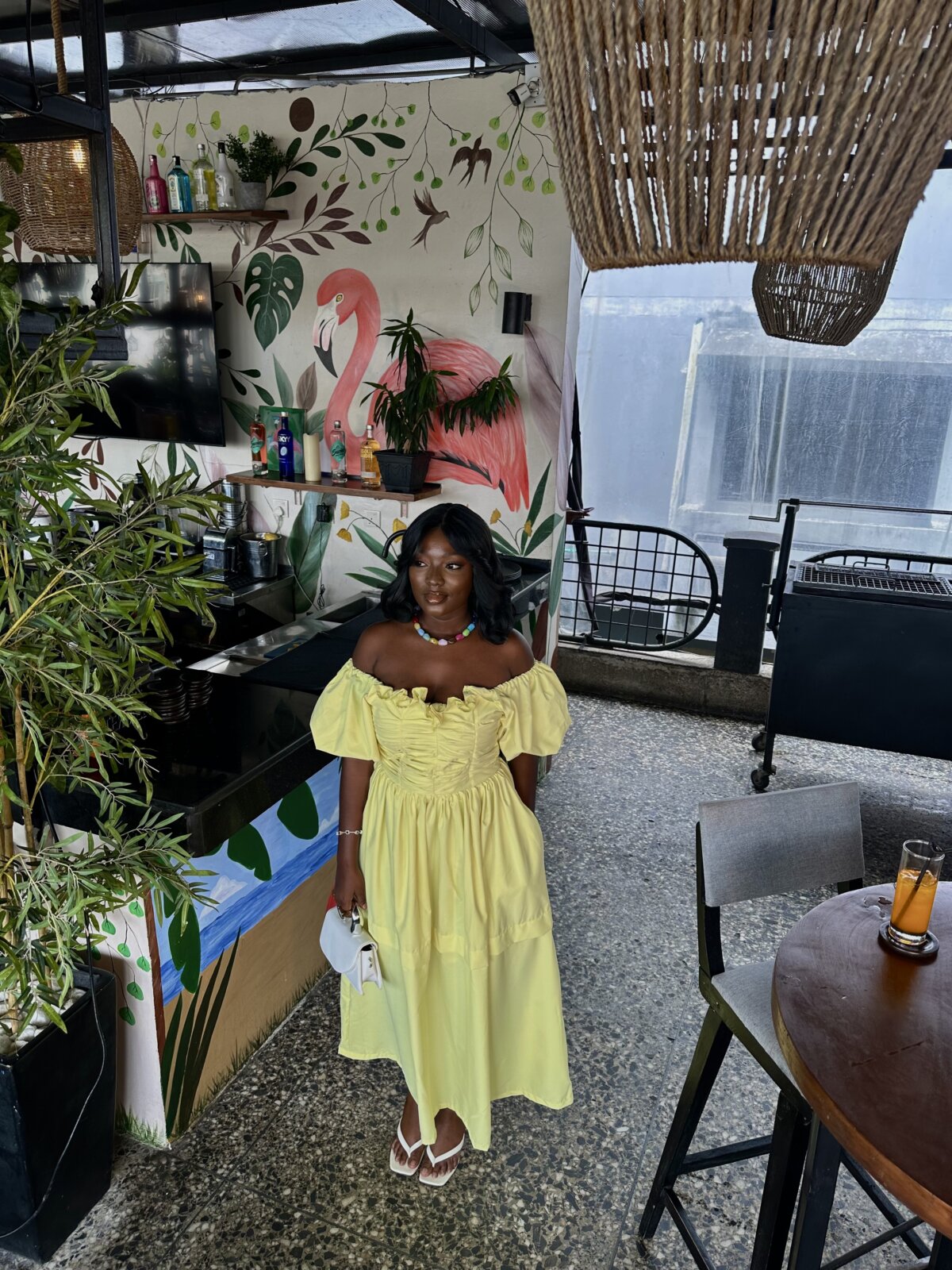 Wumi Tuase-Fosudo in the Shop Mona Celine midi dress at The Terrace Lagos