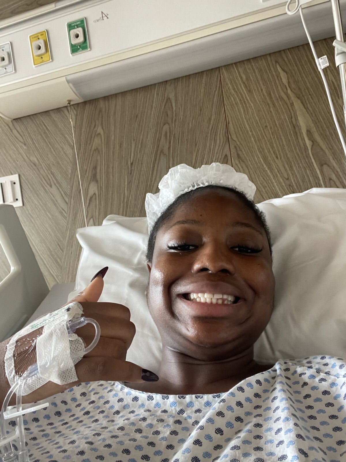 Boluwatife in a hospital gown in the hospital via Boluwatife