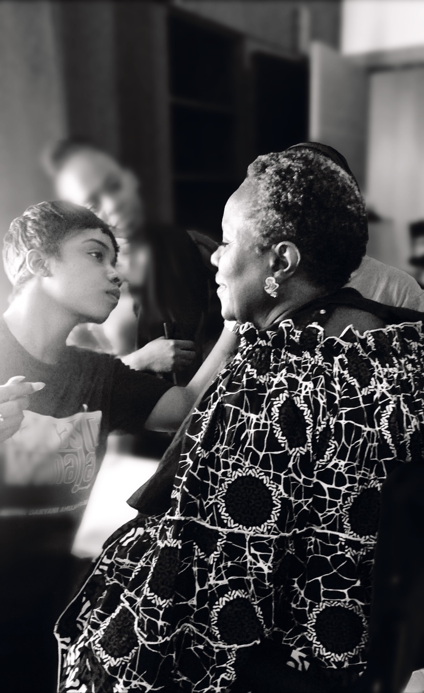 Portrait of Temitope Onayemi doing makeup on Joke Silva via Temitope Onayemi