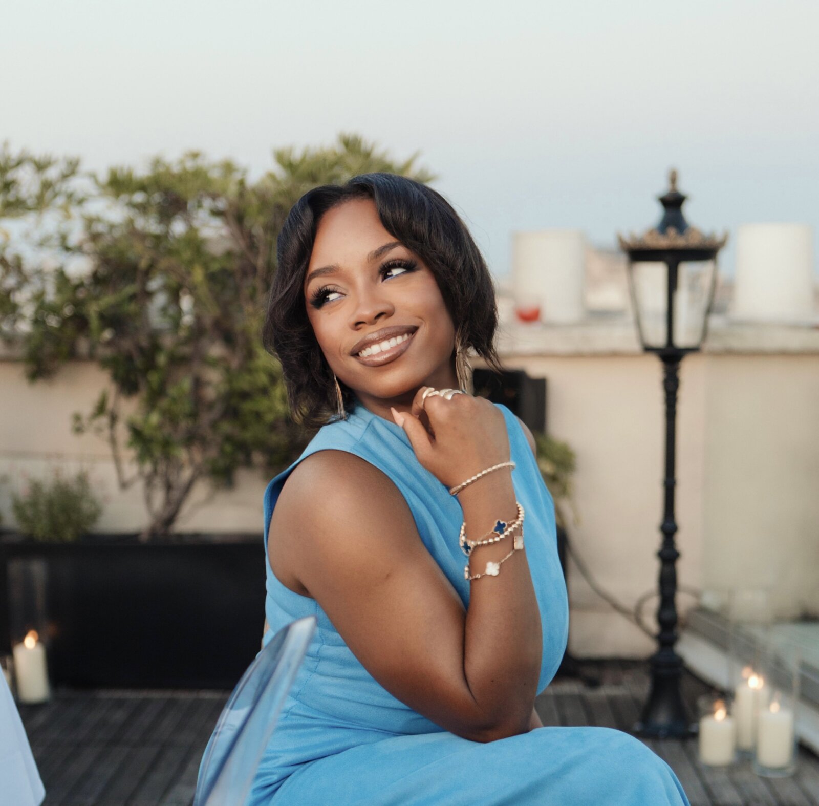 Portrait of Temitope Onayemi in a blue dress via Temitope Onayemi