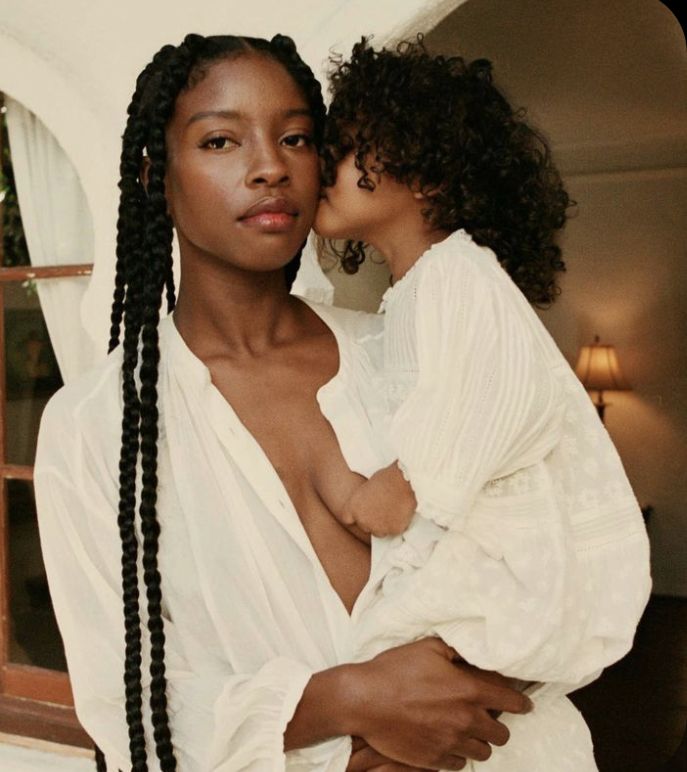 A mother carrying her child via Pinterest