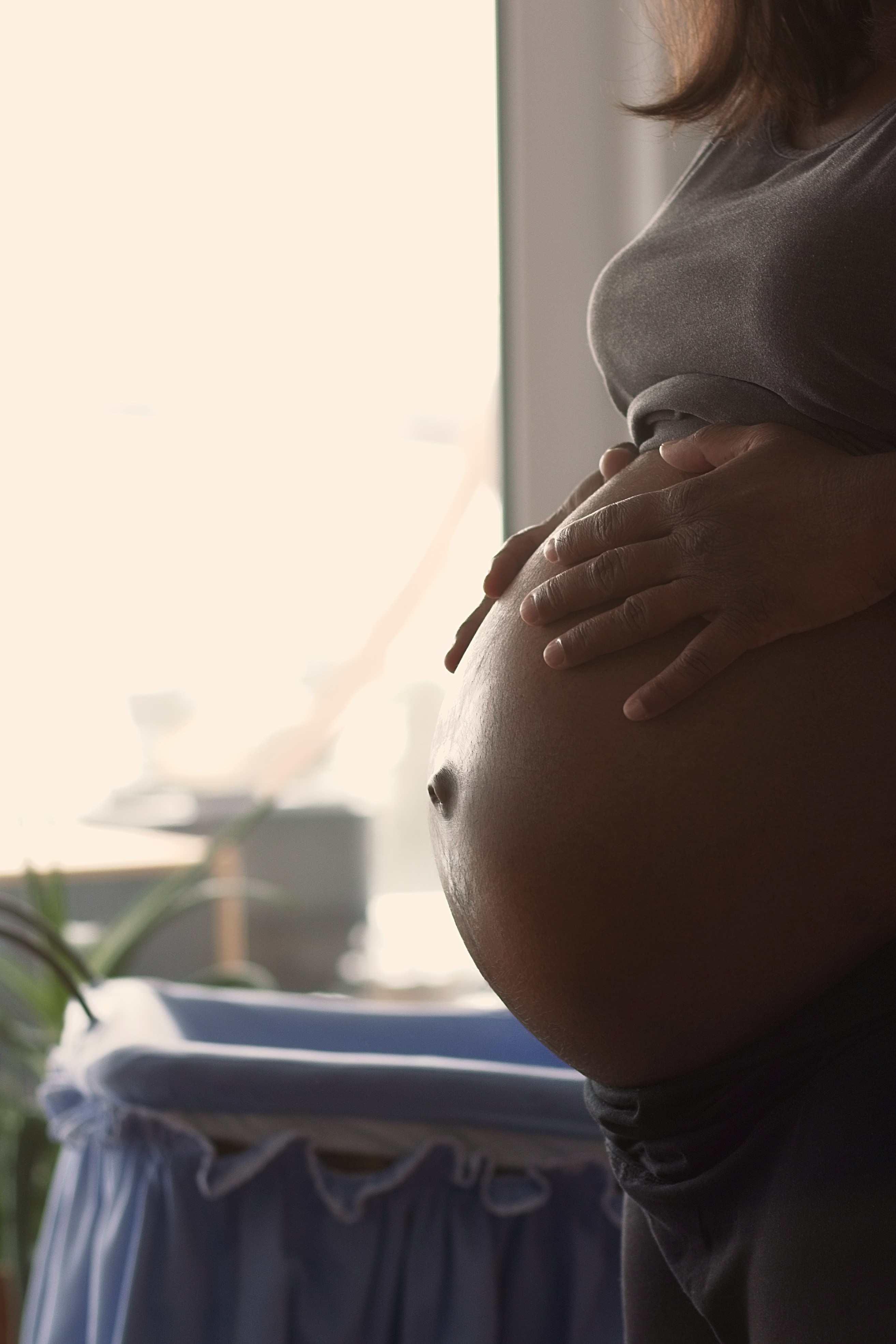 A Black pregnant woman by Stefan Lehner via Unsplash