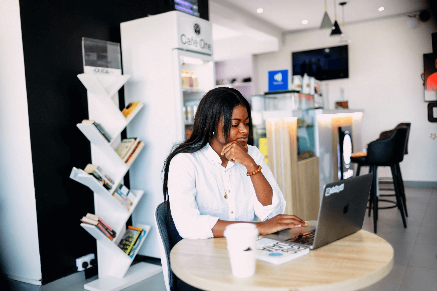 A woman working on her laptop by ninthgrind via Unsplash