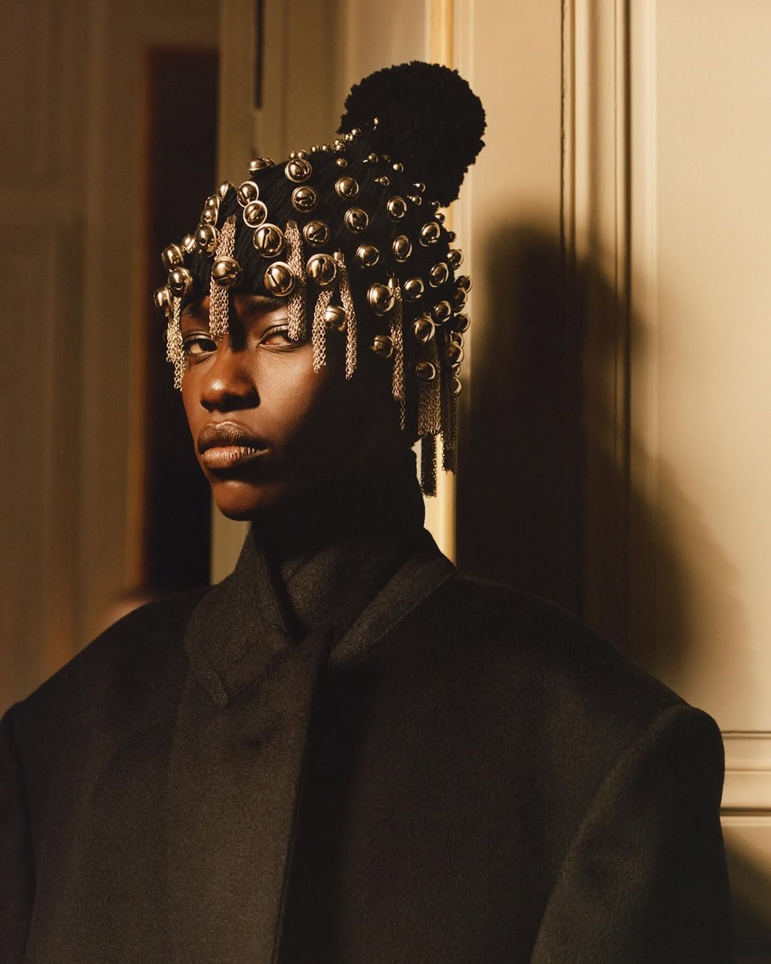 BoF class of 2025; Awar Odiahang in a Black Suit and silver headpiece 