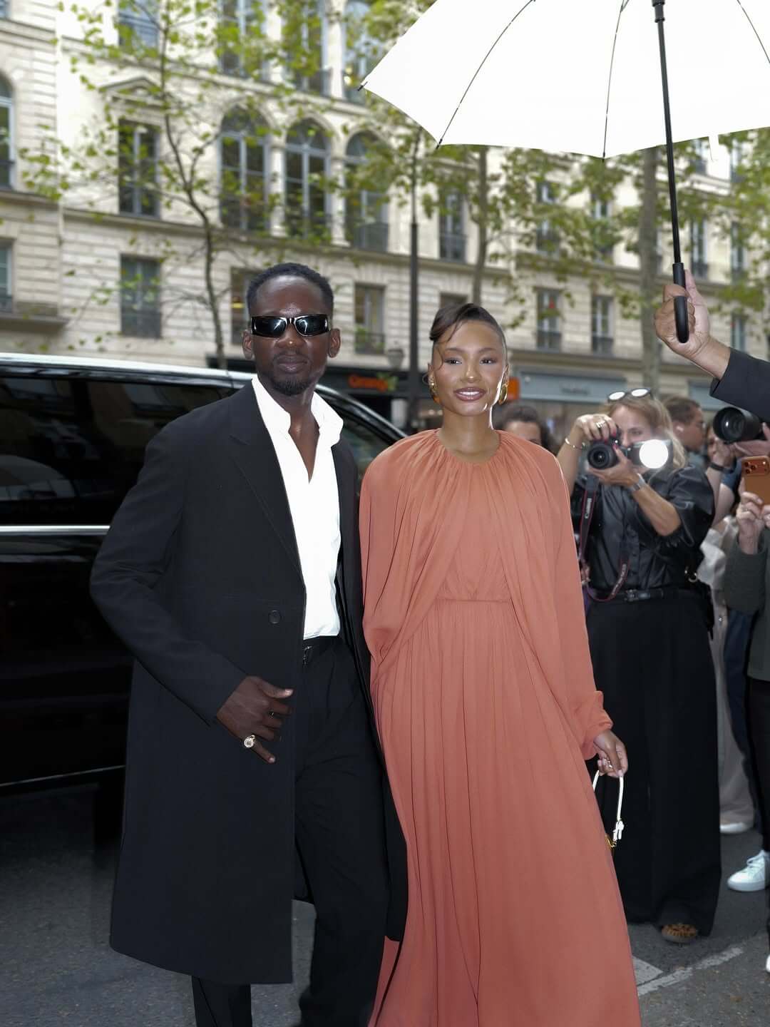  Mr Eazi and Temi Otedola outside the Giambattista Valli show venue 