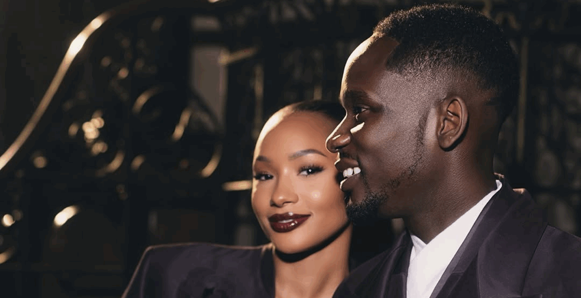 Temi Otedola and Mr Eazi in matching deep plum Casablanca satin suits at Paris Fashion Week