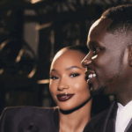 Temi Otedola and Mr Eazi in matching deep plum Casablanca satin suits at Paris Fashion Week