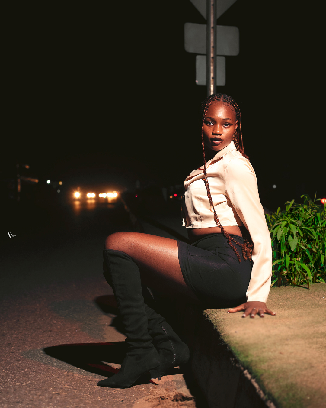  Portrait of Phoebe Oluwakemisola Christiana Babajide outside beside a road sign via Phoebe