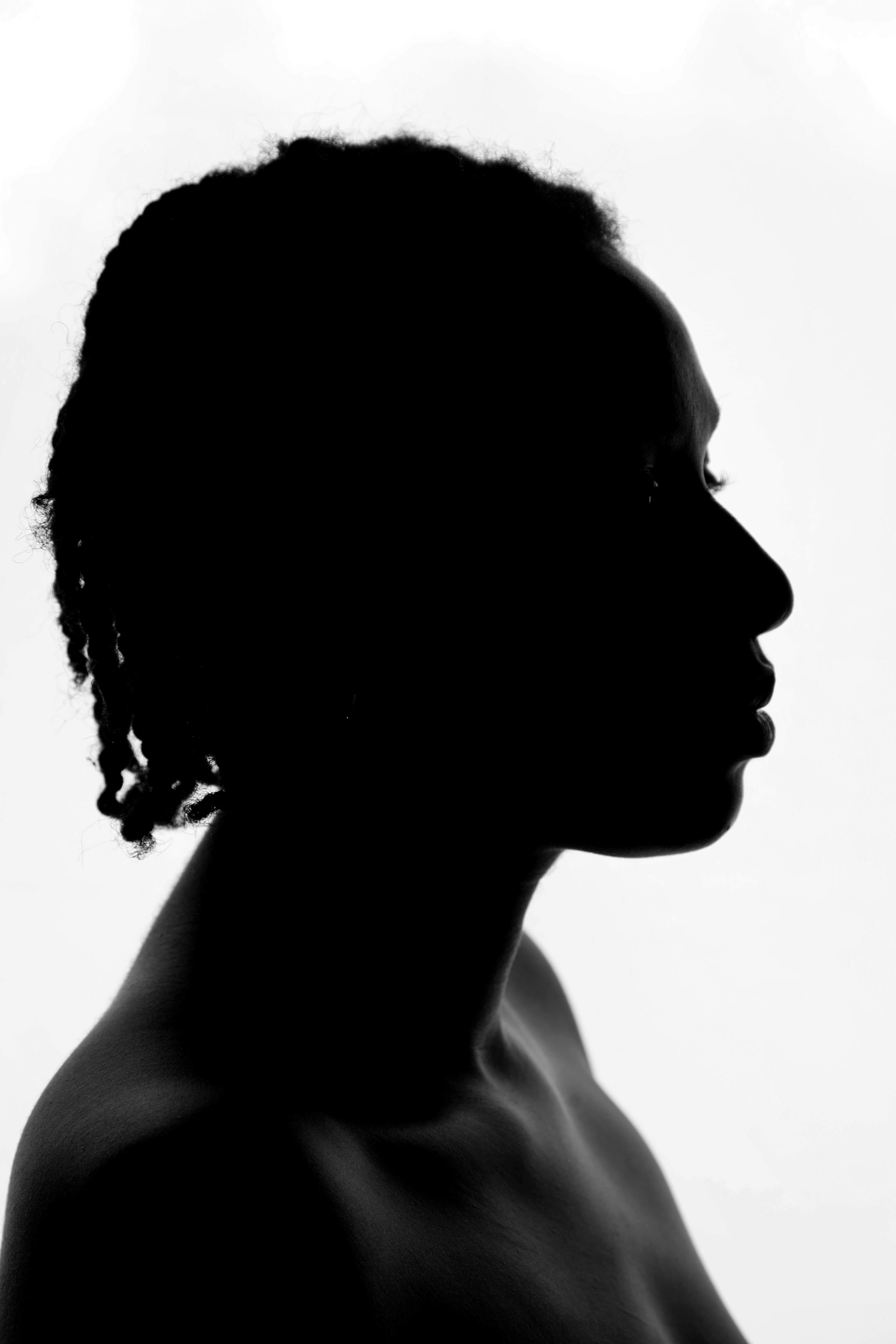 A black and white photo of a Black woman via Unsplash