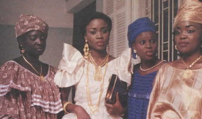 Old photo of four women wearing traditional attires via Pinterest