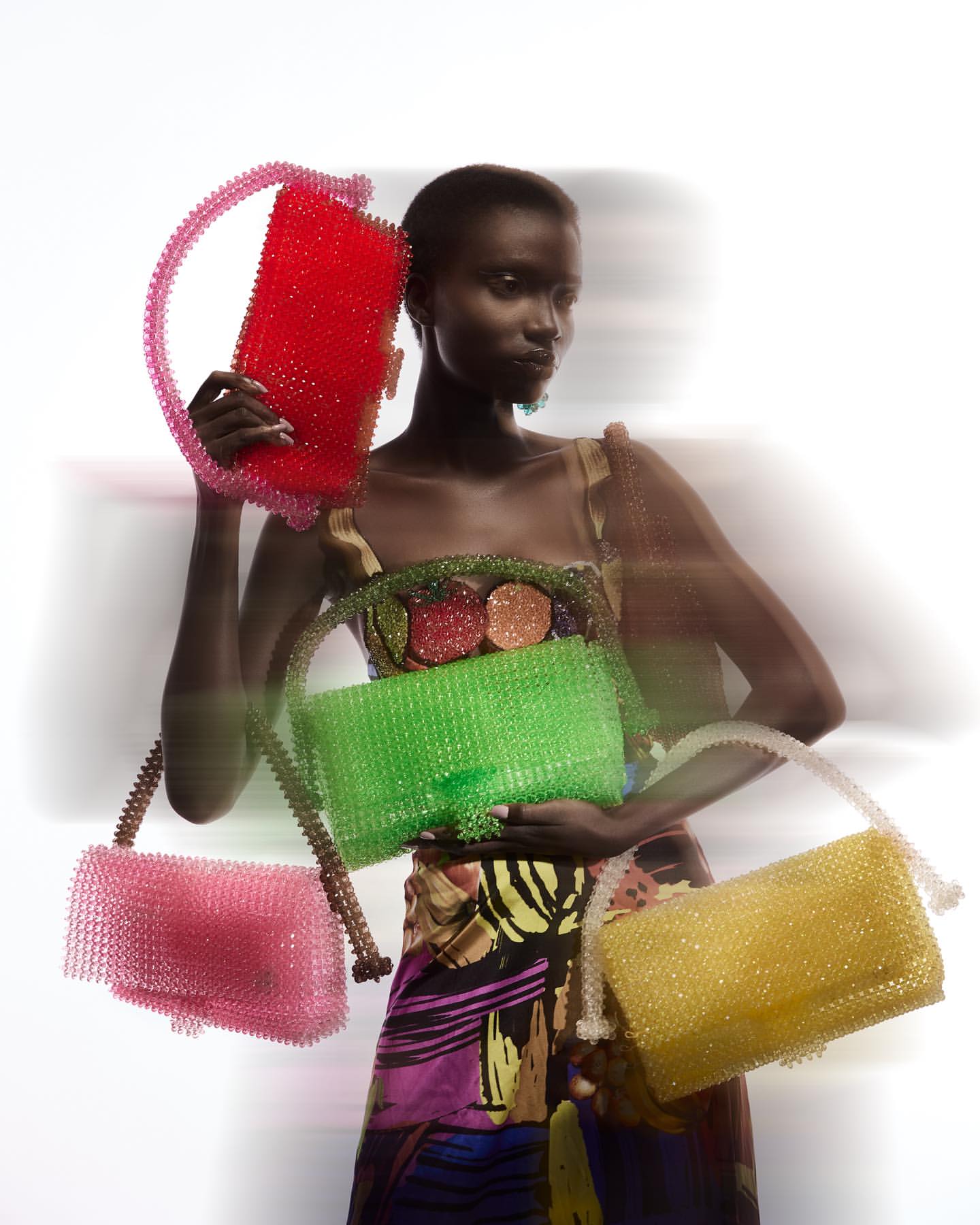 Black Woman holding bags by Lisa Folawiyo via @Lisafolawiyo on Instagram