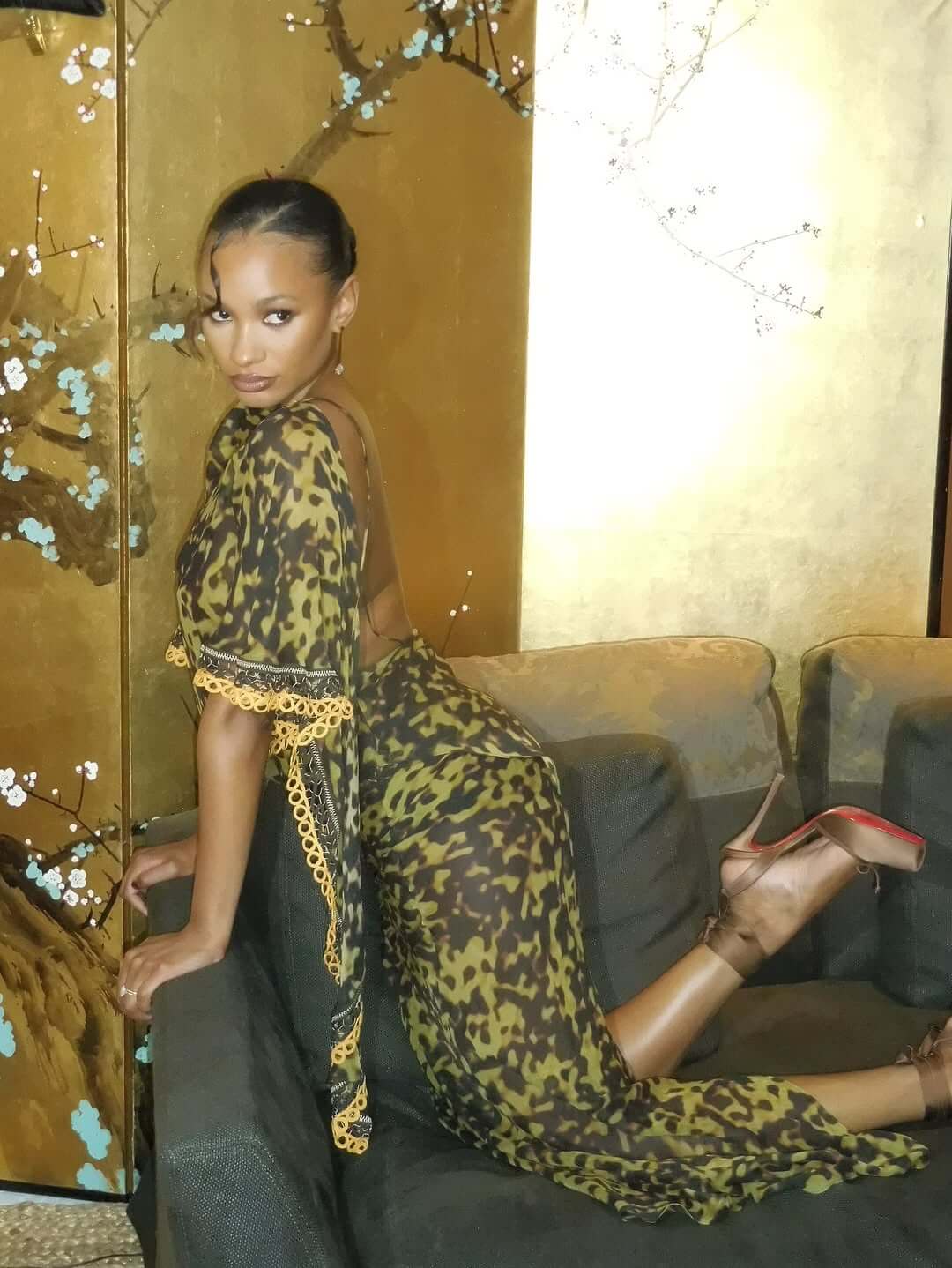 Temi Otedola in a sheer olive-green Christopher Esber dress