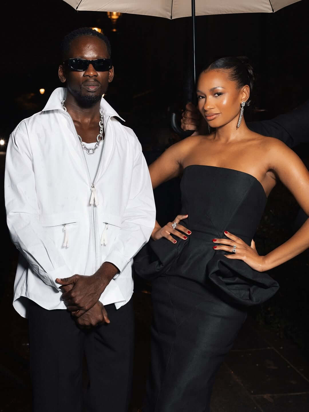 Mr Eazi and Temi Otedola posing side by side at the Messika High Jewellery show