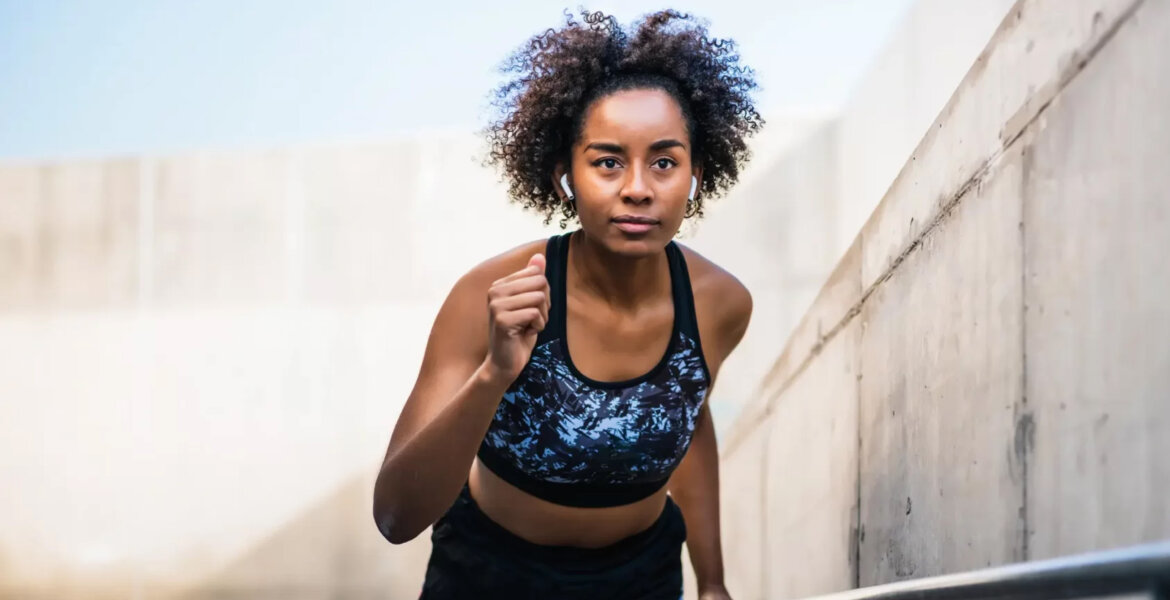 A black woman jogging via Shutterstock