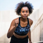 A black woman jogging via Shutterstock