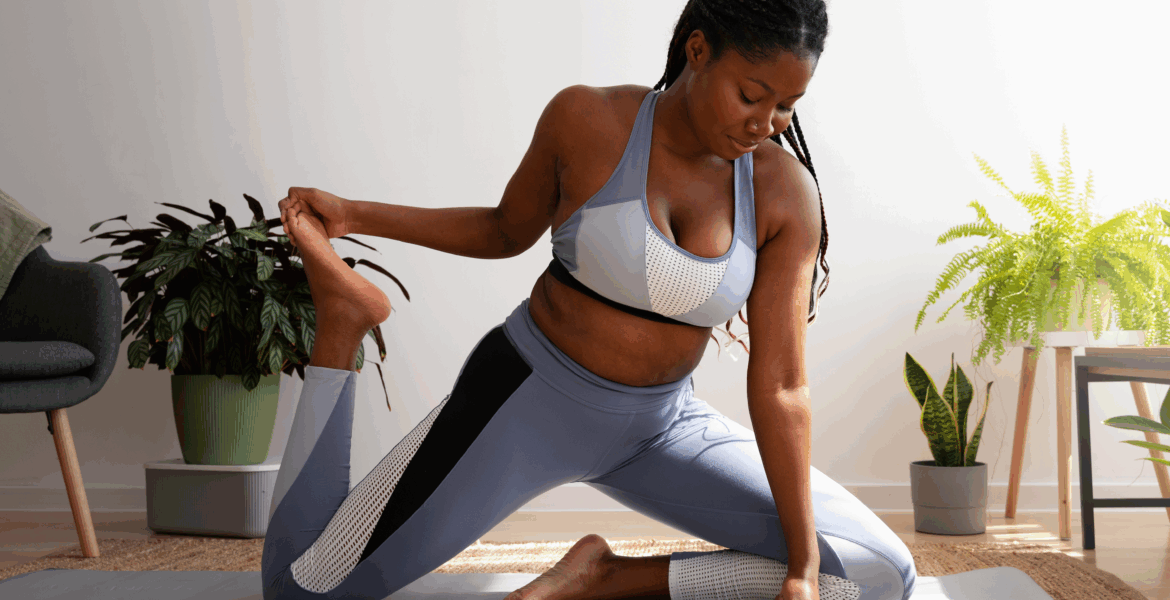 A black woman practising Yoga via Freepik