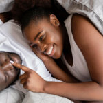 A married couple cuddling in the bedroom va Freepik