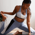 A black woman practising Yoga via Freepik