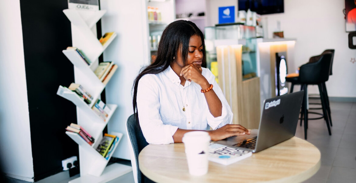 Hustle Culture: A woman working on her laptop by ninthgrind via Unsplash