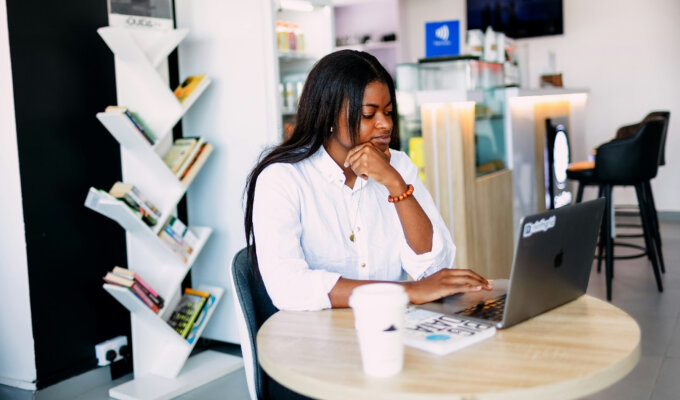 Hustle Culture: A woman working on her laptop by ninthgrind via Unsplash