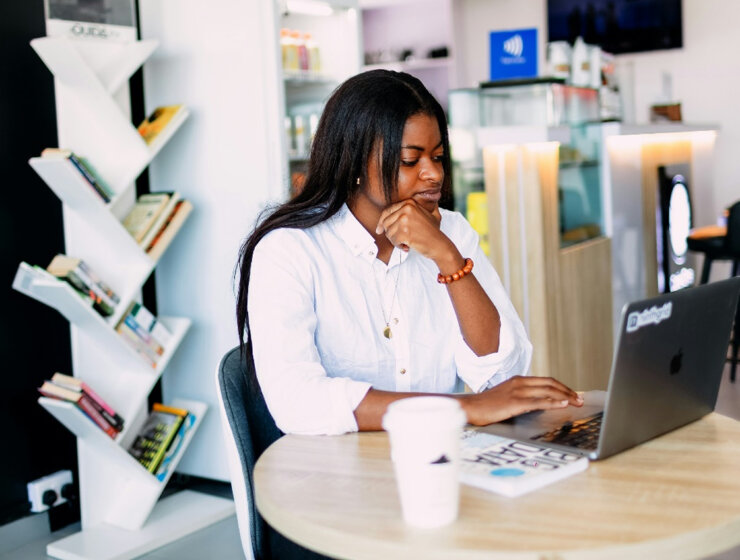 Hustle Culture: A woman working on her laptop by ninthgrind via Unsplash