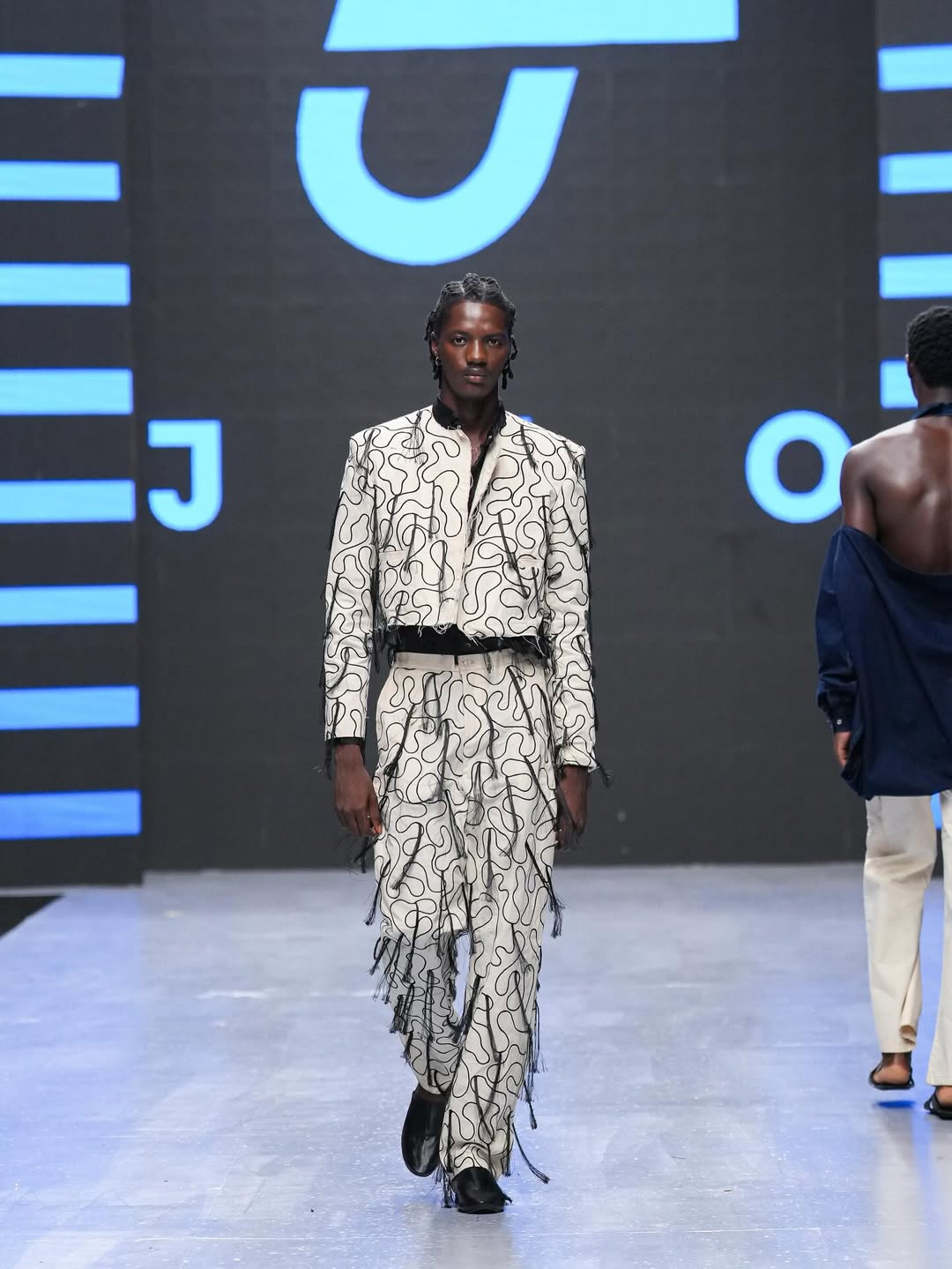 Male model wearing designer, JZO designs on the runway at Lagos Fashion Week @lagosfashionweek on Instagram