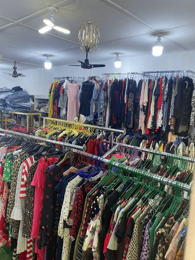 Colourful thrift clothes in a thrift shop