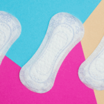 Three white sanitary pads with subtle floral patterns displayed on a bold geometric background in blue, pink, and beige.