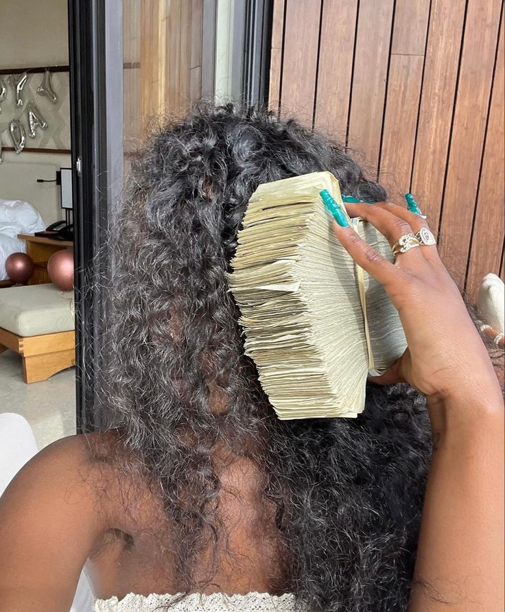 Black Woman holding a stack of money from Rich husband via Pinterest (original creator unknown, if this is your work please reach out for proper credit)