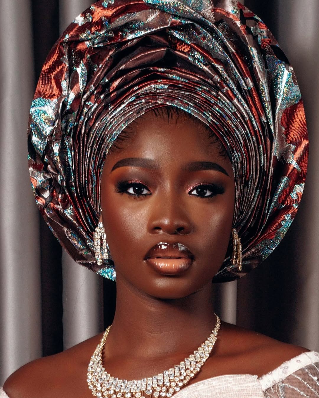 December: Beautiful woman with gele and jewellery 