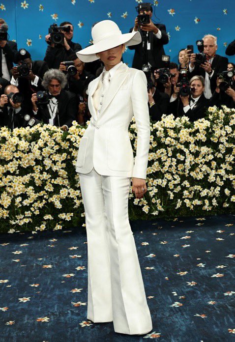 Zendaya in her white with three-piece power suit designed by Pharrell Williams for Louis Vuitton for the 2025 Met Gala