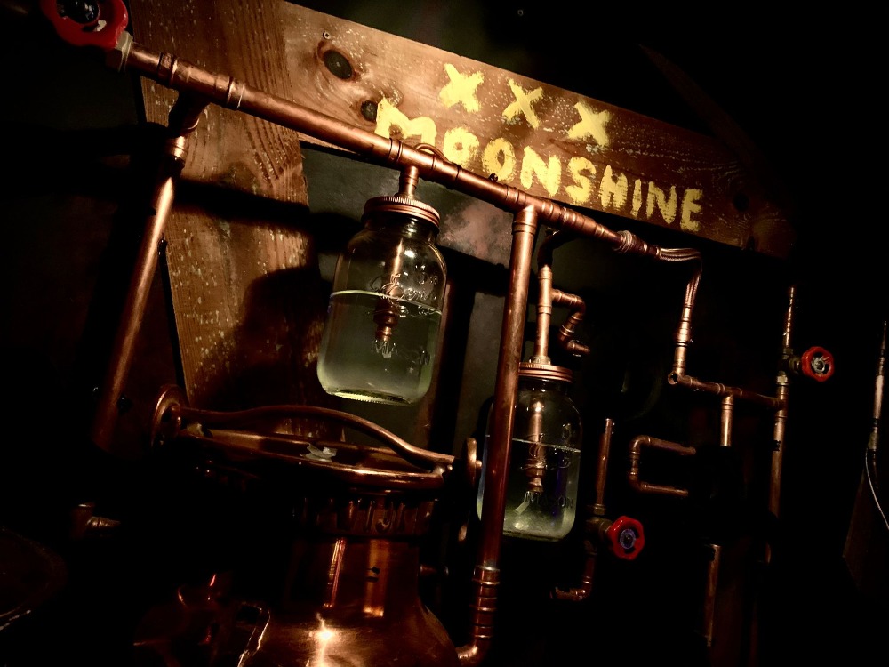 Dwayne's moonshine still in Southern Discomfort escape room at Hounds