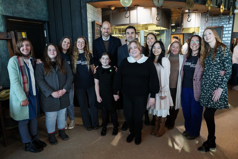 Staff and volunteers meeting Prince William