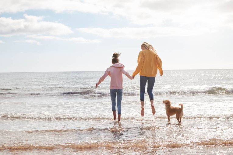 Mother and Daughter in Sea shutterstock_1631745130