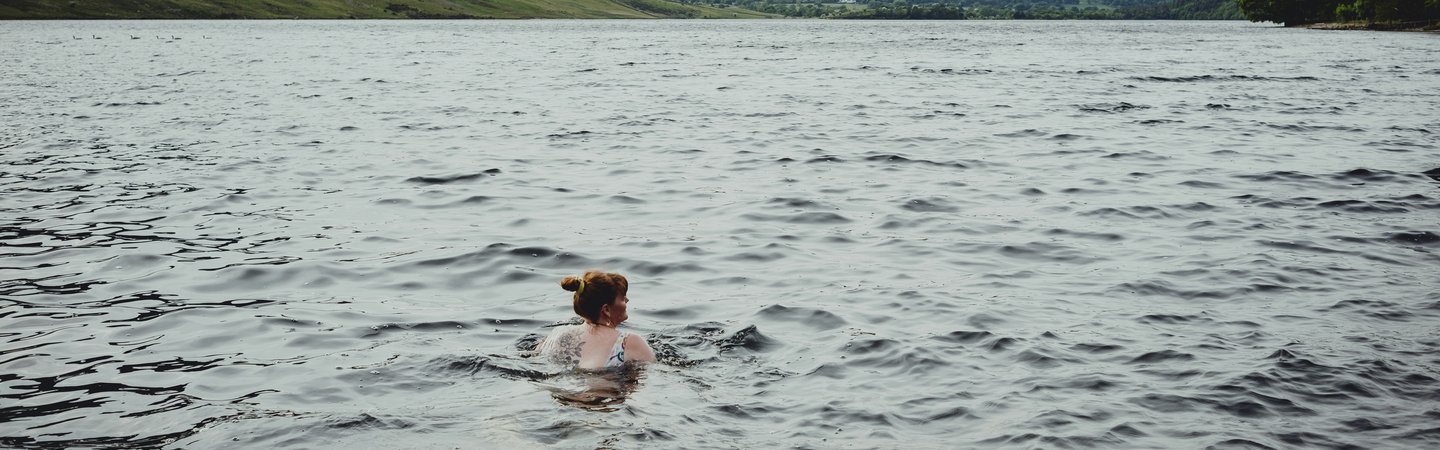 Woman swimming in the sea or lake