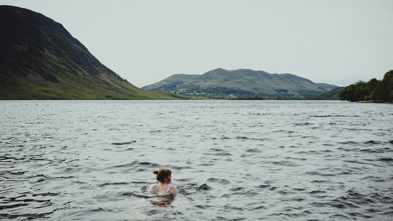Woman swimming in the sea or lake