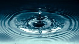 Water droplet in clear water
