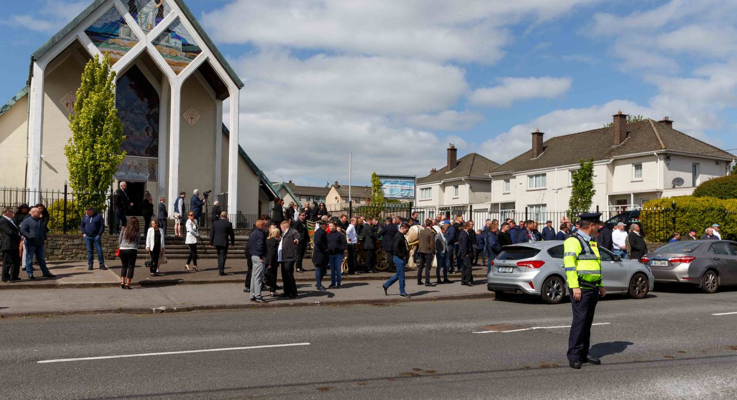 More than 100 people gather outside church for Traveller funeral in
