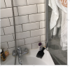 photo-0-Réparation d'une fuite due à une mauvaise jointure entre une vitre pare douche posée sur une baignoire